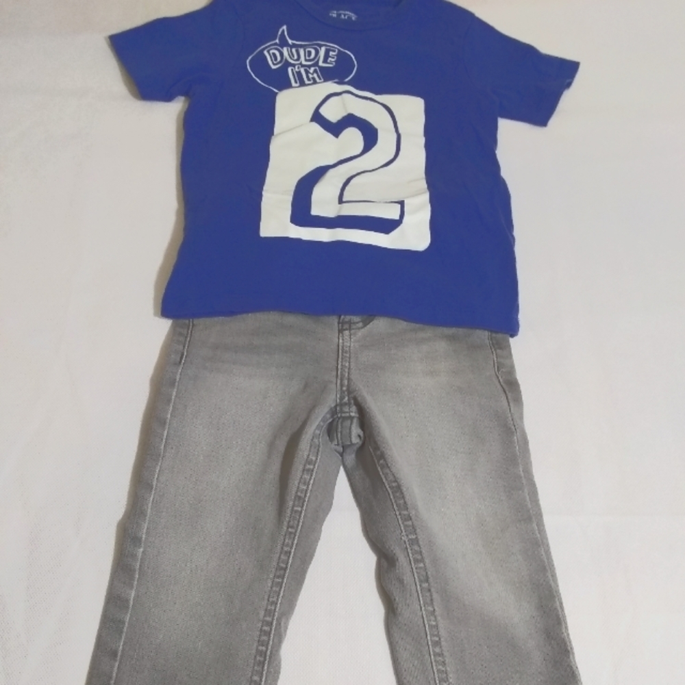 Kids blue shirt and grey pants outfit.